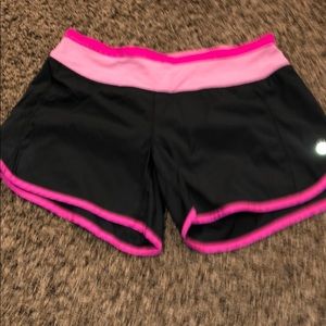 Lululemon turbo run shorts size 4. Black and pink